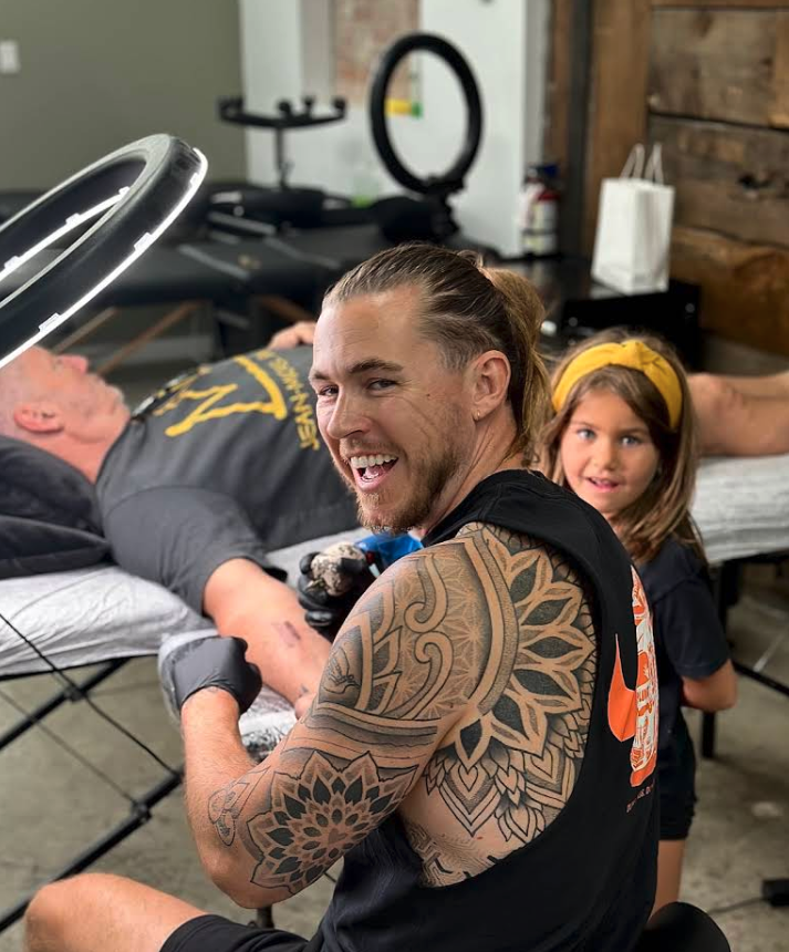 JB smiling mid-session with his mandala shoulder piece